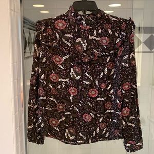 Hinge floral blouse with subtle ruffle detailing.